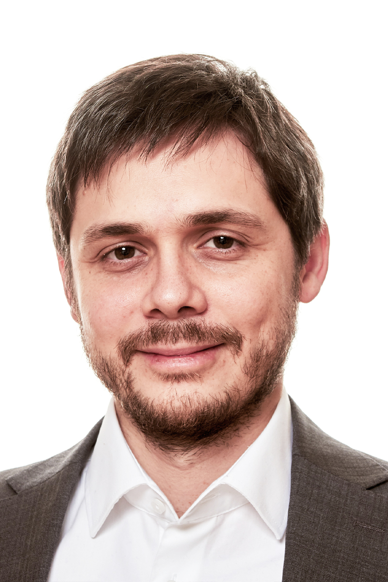 Portrait of Ralph Zlabinger infront of a white background.